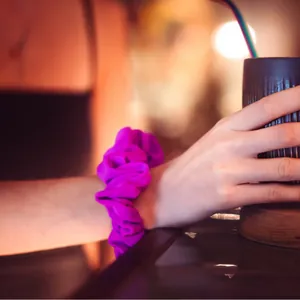 Fuchsia Tailsip scrunchie worn on the wrist